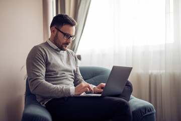 Man working at home on laptop