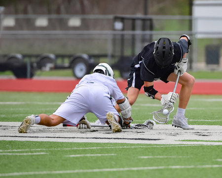 Fierce Lacrosse Action Between two teams in a LAX Match