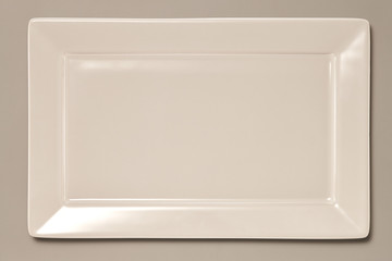 Empty Square Plate isolated on Grey Background with Real Shadow. Top View