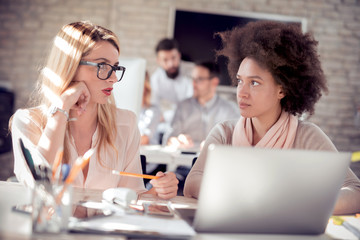Two women working together in office.