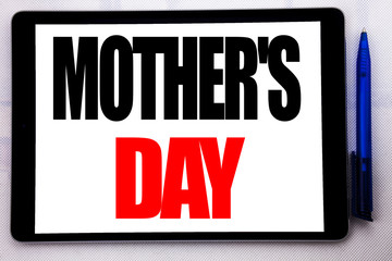 Conceptual hand writing text caption inspiration showing Mother Day. Business concept for Mom Greetings Celebration written on tablet computer on the white background with pen in the office.
