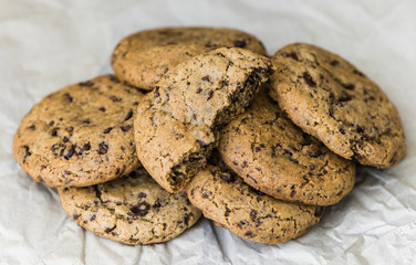 Freshly Baked Chocolate Cookies on Baking Paper. Sweet Biscuits. Homemade pastry.