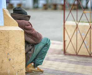 Poor man begging for money on street