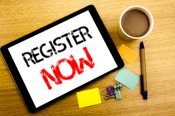 Handwritten text caption showing Register Now. Business concept writing for Registration For Written on tablet laptop, wooden background with sticky note, coffee and pen