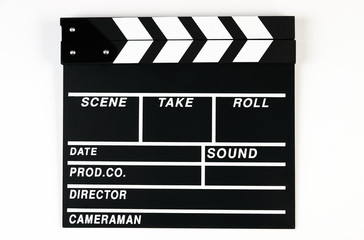 Movie production clapper board. Black clapperboard isolated on white background with copy space, close-up. 