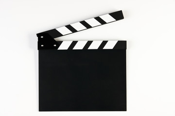 Movie production clapper board. Black clapperboard isolated on white background with copy space, close-up. 
