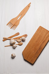 Fototapeta na wymiar Fresh sliced garlic in glass bowl on wooden background.