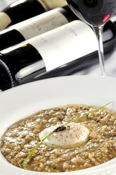 Risotto with three funghi with egg poche and black truffle