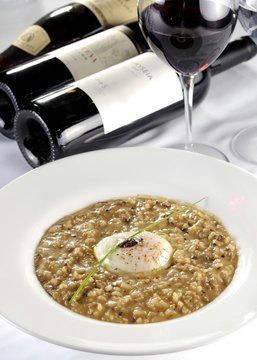Risotto with three funghi with egg poche and black truffle