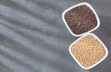 Yellow and black mustard grains
