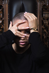 Emotive young model in black