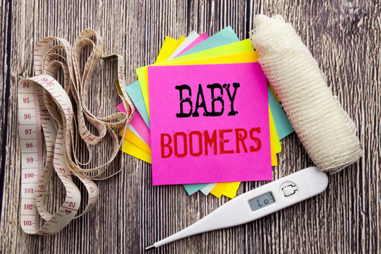 Handwriting Announcement text Baby Boomers. Business fitness health concept for Demographic Generation written sticky note empty paper background with bandage and thermometer