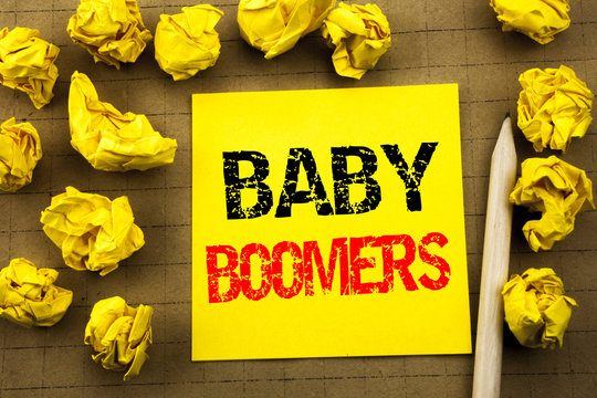 Handwriting text showing Baby Boomers. Business concept for Demographic Generation written on sticky note paper on the vintage background. Folded yellow papers on the background