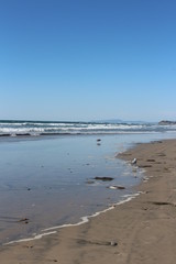 Solana Beach, CA coastline at low tide on a sunny day