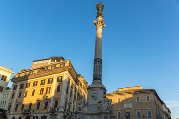 Fototapeta na wymiar Sunset view of Column of the Immaculate near Spanish Steps and Piazza di Spagna in city of Rome, Italy