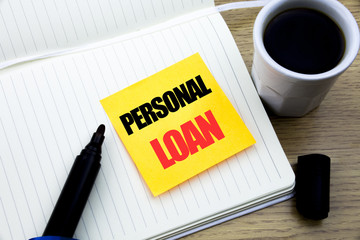 Hand writing text caption inspiration showing Personal Loan. Business concept for Bank Financial Help written on sticky note paper, Wooden background with space, Coffee and marker