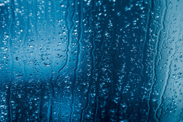 water drops of rain on a window glass. Rainy day