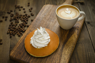 pancake with coffee on wooden table
