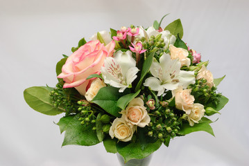 close up of rose bush, alstroemeria, bouvardia and salal in greeting bouquet