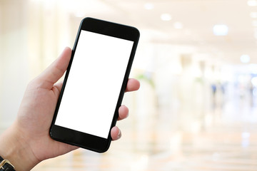 Hand using smart phone over blur bokeh light background, mock up, business and technology, internet of things concept