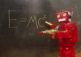 retro red robot teacher at a blackboard with a ray gun 