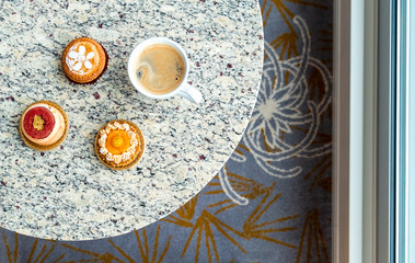 Handcrafted gourmet fruit tarts and pastries with coffee
