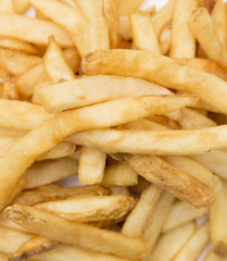 A Pile of French Fries with their Peels Included