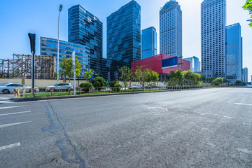 city empty traffic road with cityscape in background.