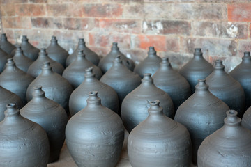 Fototapeta na wymiar Rows of Drying Pottery