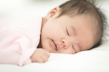 Baby sleeping in bed ,