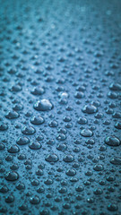 water drop pattern in blue color tone, select focus in vignette effect