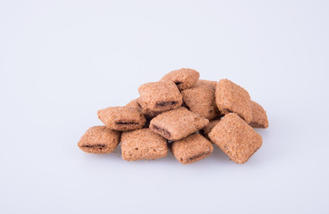 cookie or biscuits filled with chocolate cream on a background.