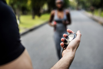 Hand holding a stopwatch