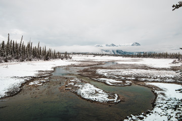 The snow is melting in Jasper National Park, filling the rivers to overflowing