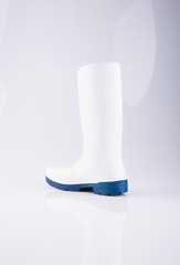 shoe or white color rubber boots on a background.