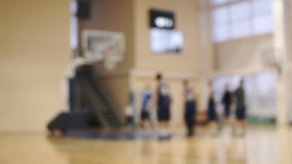 throws the ball into the basket. warm-up of the basketball team - Powered by Adobe