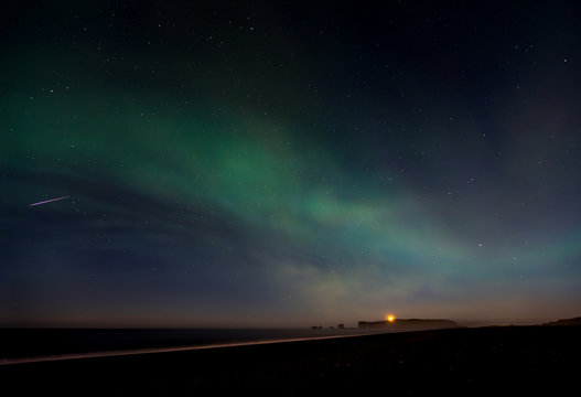 Green Aurora borealis over Reynisfjara Beach, Iceland