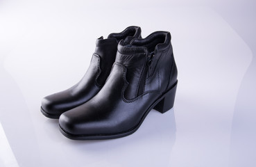 shoe or black color lady shoes on a background.