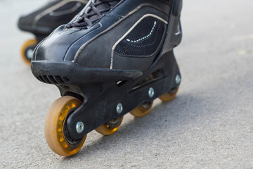 Fototapeta na wymiar Roller skate on Asphalt Close-up