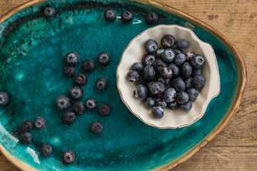 Healthy eating concept. Blueberries in small  white ceramice pla