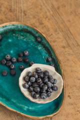 Healthy eating concept. Blueberries in small  white ceramice pla