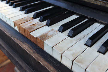 Detail of old, broken and dusty piano claviature