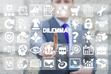Businessman pressing dilemma text button on a virtual interface. Business dilemmas. Business development concept for lost, confusion, directions or  decisions.