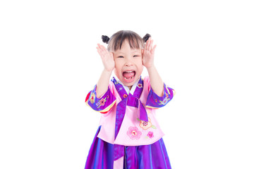 Little asian girl wearing korean traditional costume and smiles isolated over white background