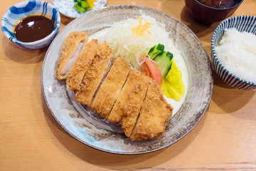 Tonkatsu,Japanese style Deep fried pork with vegetables, rice,sauce and soup.