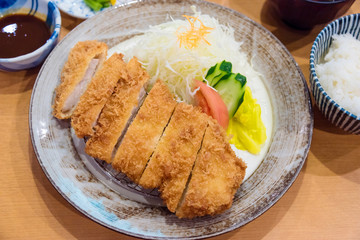 Tonkatsu,Japanese style Deep fried pork with vegetables, rice,sauce and soup.