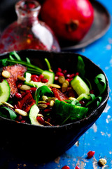 AUTUMN ARUGULA SALAD WITH CARAMELIZED SQUASH with  POMEGRANATE GINGER VINAIGRETTE