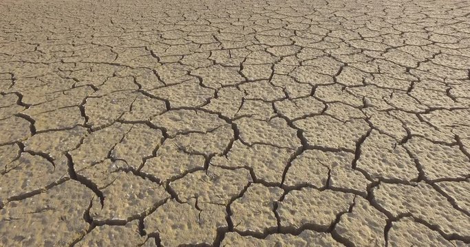 Pattern of cracks in the mud during a drought moving forward