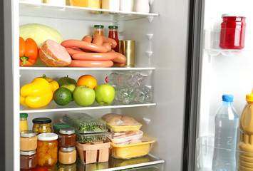 Many different fresh products in modern refrigerator