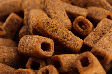 Beer spicy brown snacks closeup with blur, background.